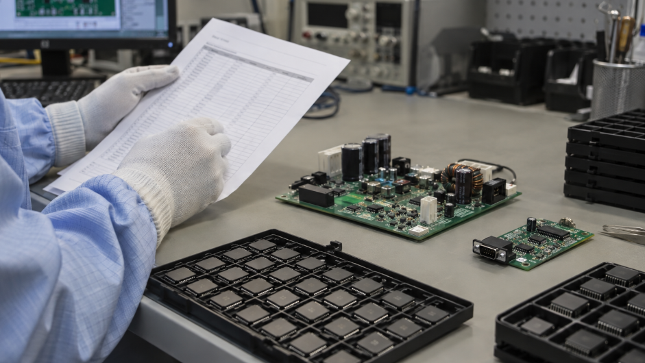 Industrial Control Board And IC Trays At An ESD Workstation